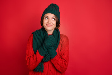 Photo of young woman happy positive smile dream look empty space holiday isolated over red color...