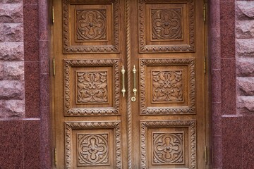 Blue grunge wooden door in brick wall