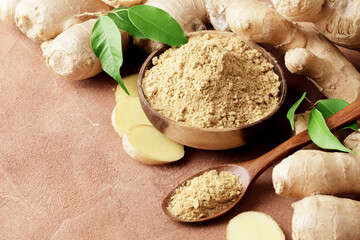 Composition of fresh and dry ginger on a textured background.