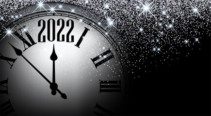 Fototapeta na wymiar Half hidden clock showing 2022 with stars confetti.