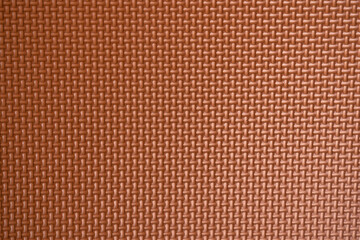 Dark brown surface texture of the rubber floor mat. Copy-space