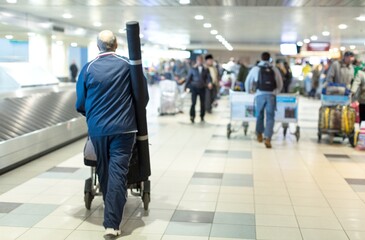 Passengers Walking in Airport Terminal