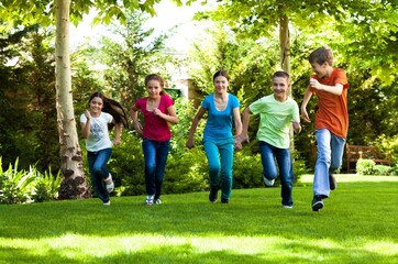Portrait of Children Running in Park