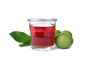 Delicious liqueur and green walnuts on white background