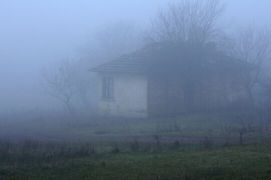 Hazy view of abandoned house