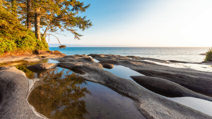 Unique Rock Formation at Sandcut Beach on the West Coast of Pacific Ocean. Summer Sunny Sunset. Canadian Nature Landscape Background. Located near Victoria, Vancouver Island, BC, Canada.