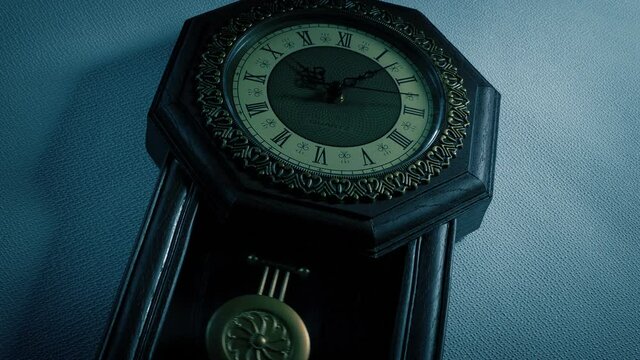Old Wall Clock In The Dark Angled Shot