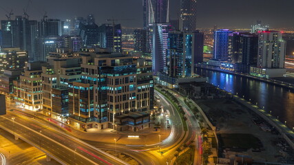 Bay Square district night timelapse with mixed use and low rise complex office buildings located in Business Bay in Dubai
