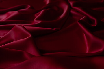 Obraz premium Red smooth cloth folds texture background