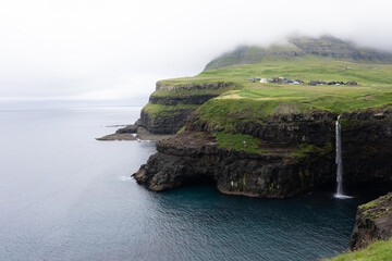 Beautiful aerial view of Gasadalur waterfall and village and landscapes in the Faroe Islands