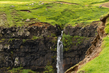 Beautiful aerial view of Gasadalur waterfall and village and landscapes in the Faroe Islands