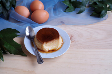Homemade egg custard on wooden table
