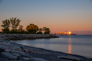 The Toronto, Ontario skyline is seen in the distance from a beach in Colonel Samuel Smith Park...