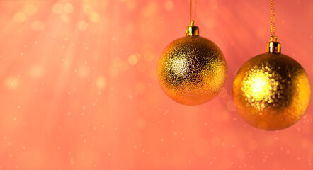 Golden Christmas balls on a defocused background.
