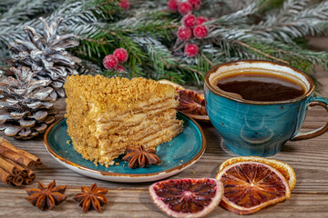 Fototapeta na wymiar Cup of coffee and dessert among the Christmas decorations. Celebrating Christmas and New Years. Home comfort.