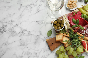 Fototapeta na wymiar Set of different delicious appetizers served on white marble table, flat lay. Space for text