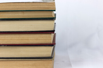 Heap of old old hardback books. Close-up of a stack of old used books