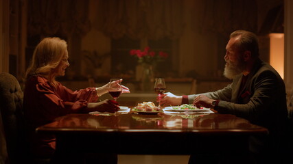Love senior couple talking romantic date in restaurant. Elderly people relaxing