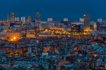 Scenic bird's eye view of Barcelona city at evening twilight