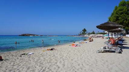 cyprus beach straw umbrellas sun loungers recreation garden resort summer