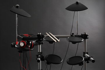 Modern electronic drum kit on grey background. Musical instrument
