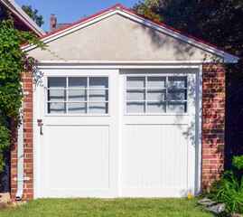 Brick, cement and wood old fashioned garage.