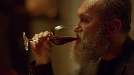 Old aged man drinking red wine glass in restaurant. Grandfather retirement - Powered by Adobe
