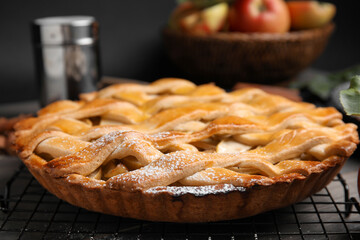 Delicious traditional apple pie on table, closeup