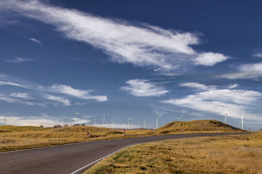 Wind turbines along a road in Chubut, Argentina