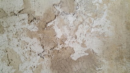 The plastered wall is gray. The wall inside the room. Background picture with scratches. Architecture and construction. Interior design. Copy space for text.