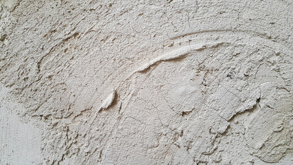 The plastered wall is gray. The wall inside the room. Background picture with scratches. Architecture and construction. Interior design. Copy space for text.