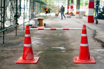An orange rubber cone was placed as a defense against a no-walk area. while walking in the...