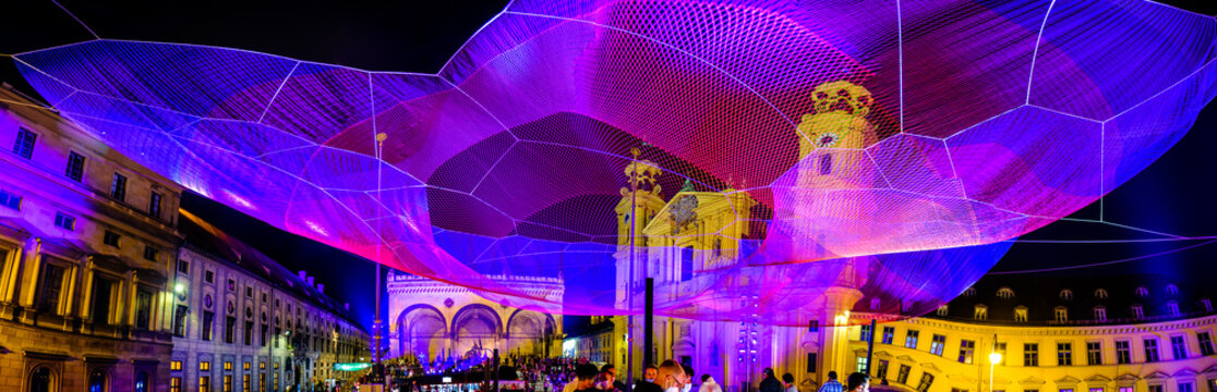 Munich, Germany - September 10,2021:Audience at the Mercedes-Benz booth at the IAA (Internationale Auto Ausstellung - translation: international car exhibition) trade fair and Art Net "Earthtime 1.26"