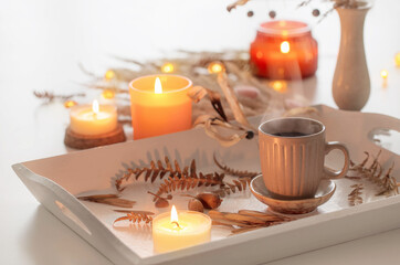 two cups of  coffee    and autumn decor on white wooden tray