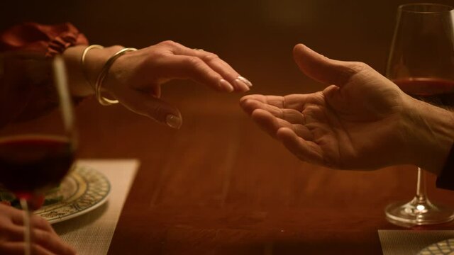 Senior love couple hands touching each other in restaurant. Family relationship