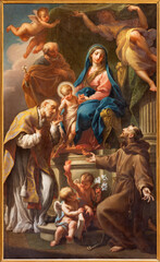 ROME, ITALY - AUGUST 31, 2021: The painting of Holy Family with St. Francis of Assisi and Augustine in the church Santa Maria in Monticelli by Sebastiano Conca (1859). © Renáta Sedmáková