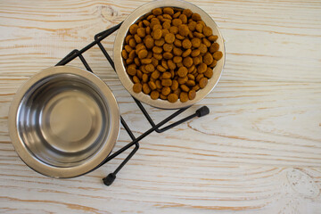 dry food for cats on a wooden background