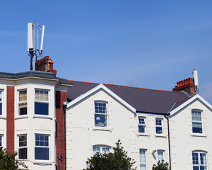 Fototapeta premium 5G cells on top of houses.