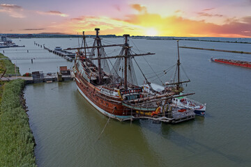 Aerial from a traditional sailing ship in the harbor from Amsterdam Netherlands at sunset