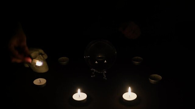 Lighting candles in dark room