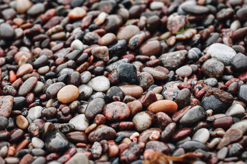 Full frame photo of small rocks at the seaside