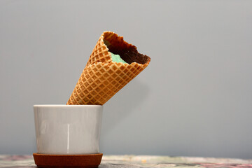 Beautiful fresh big sweet aromatic appetizing natural green cold ice cream in crispy waffle cone,...