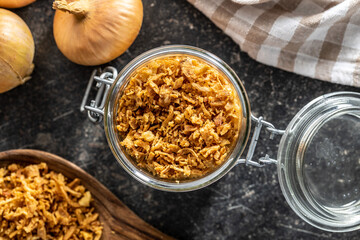 Pieces of fried onions in jar.
