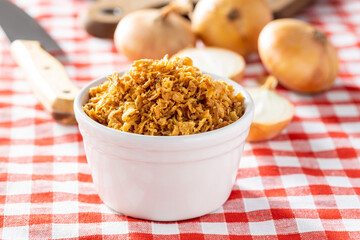 Pieces of fried onions in bowl.