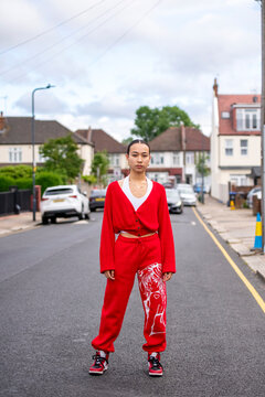 UK, London, Portrait of woman in red clothing on street