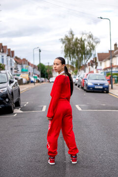 UK, London, Portrait of woman in red clothing on street