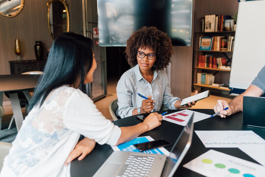Italy, Businesswomen having meeting in creative studio