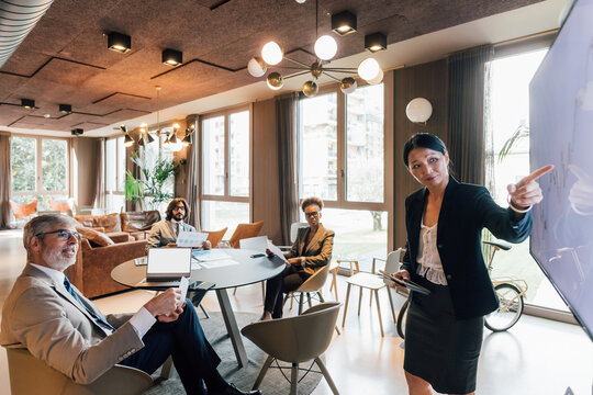 Italy, Businesswoman having presentation in creative studio