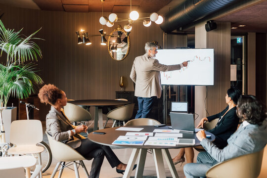 Italy, Businessman having presentation in creative studio