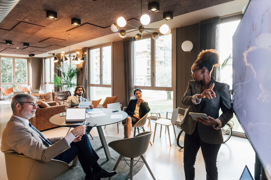 Italy, Businesswoman having presentation in creative studio